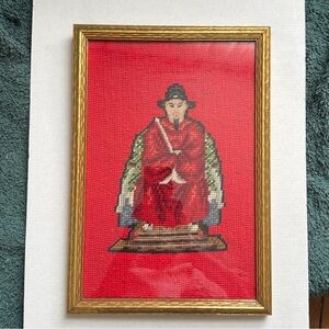 Chinese Emperor or Warrior in needlepoint in wood, gold-toned frame.